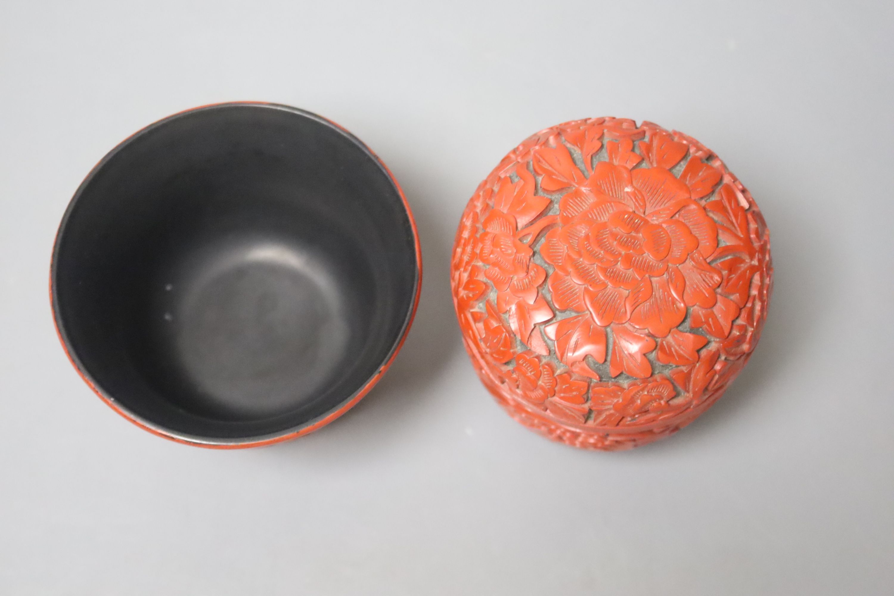 A Japanese red lacquer natsume, 7cm high, and matching tea cup